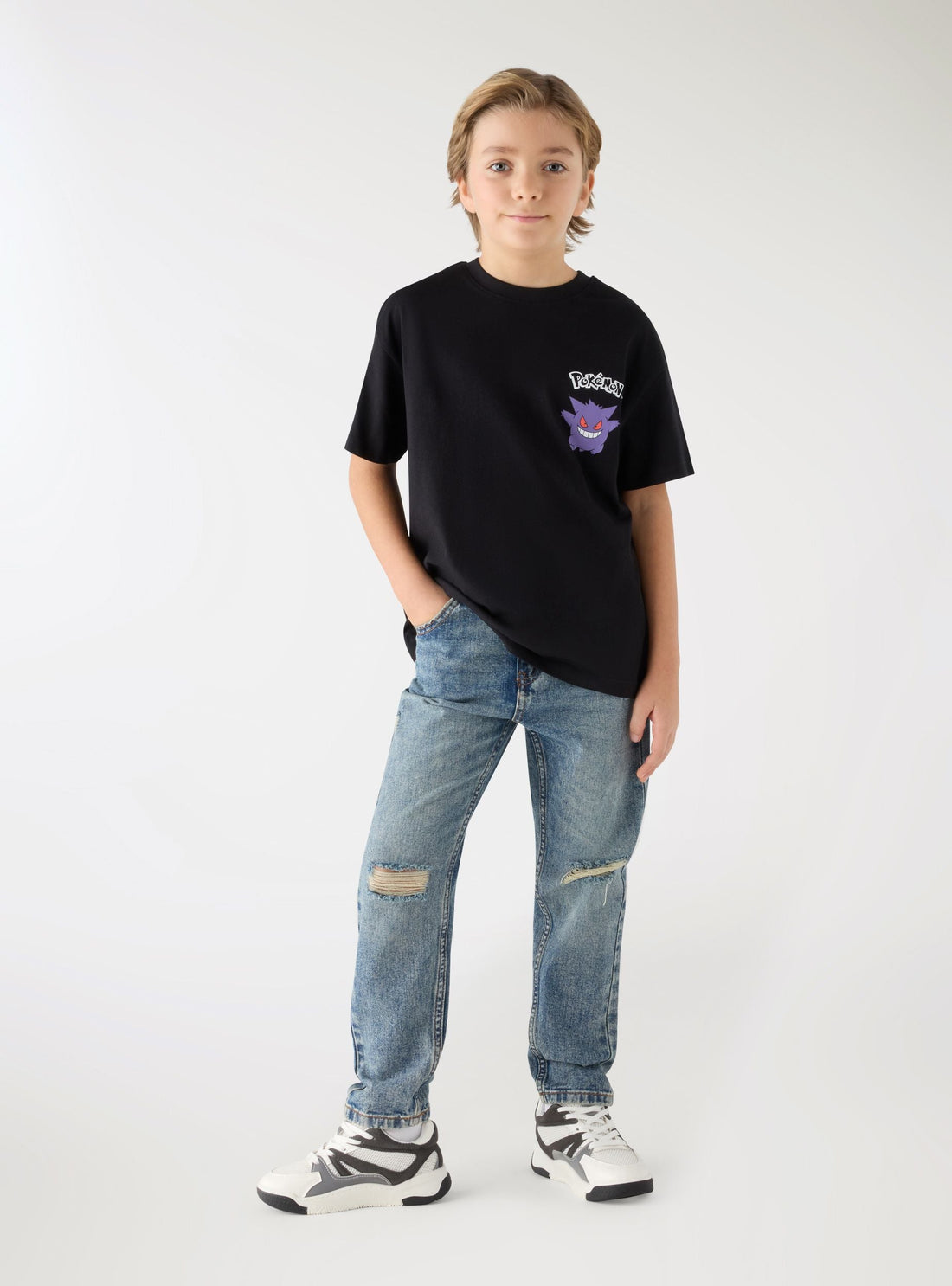 Jeans con strappi a tinta unita