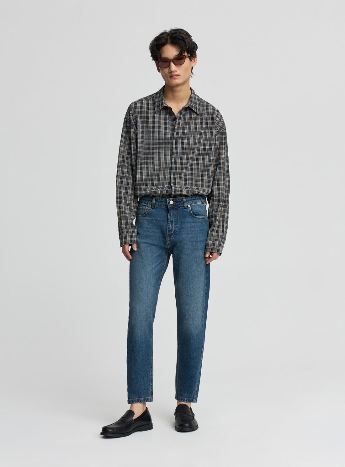 Jeans slim tapered a tinta unita