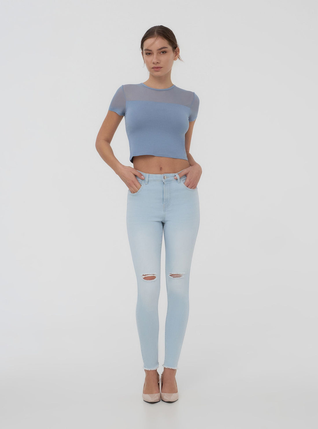 Jeans chiari skinny con strappi