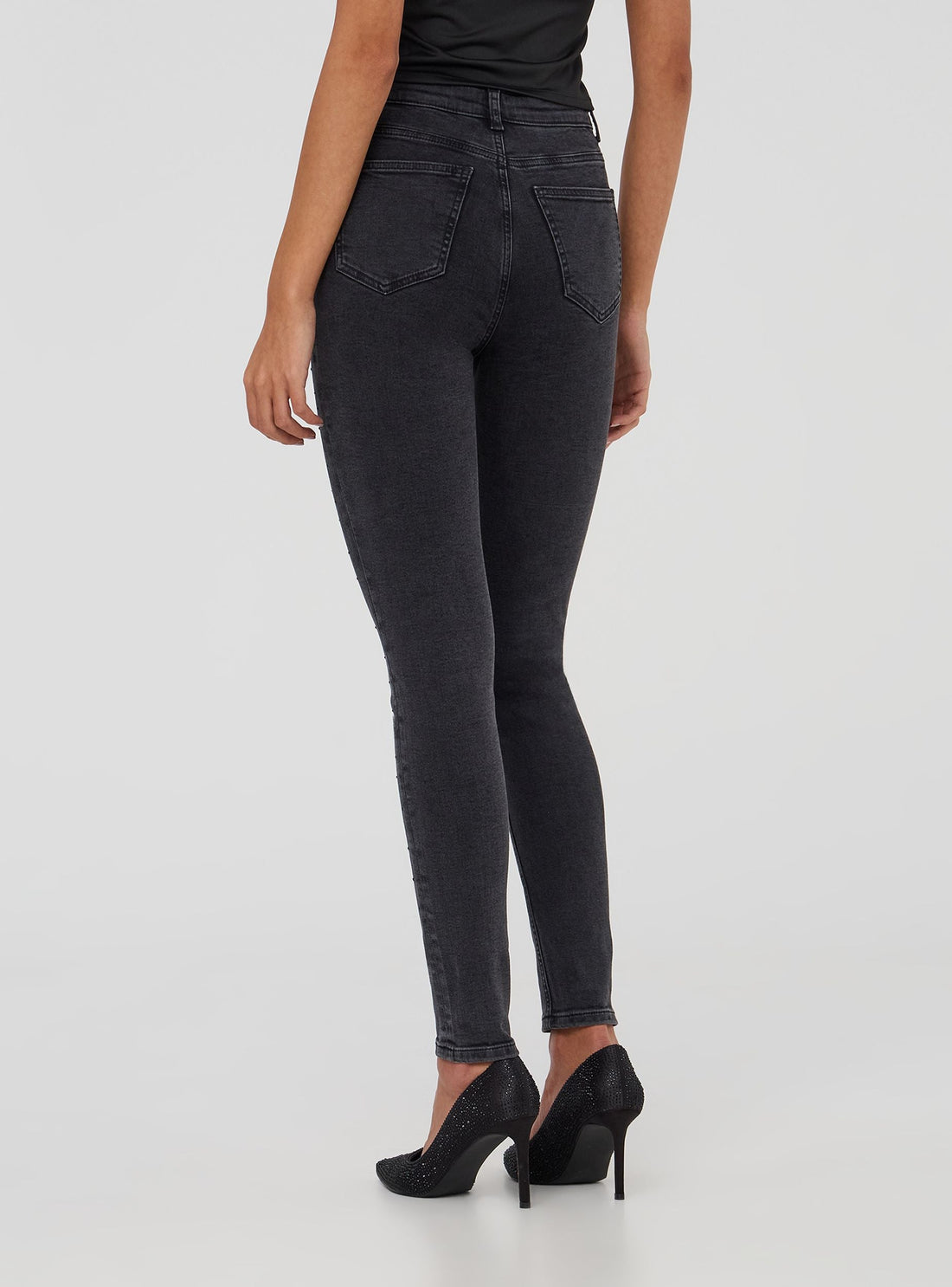 Jeans skinny con strass laterali
