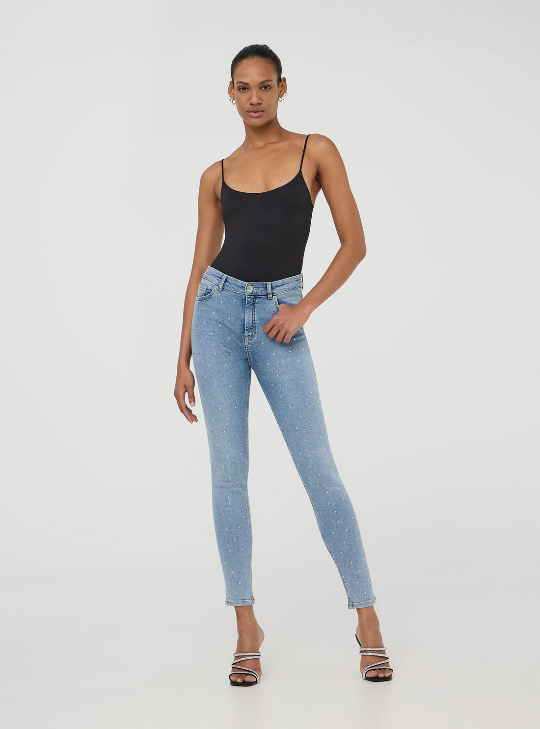 Jeans skinny con strass frontali