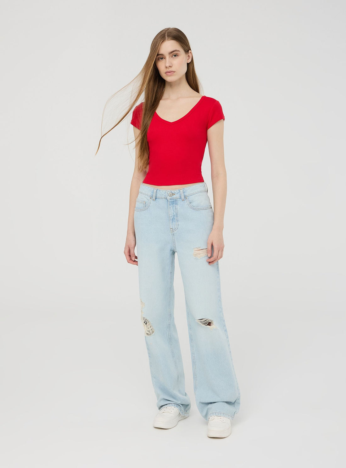 Jeans chiari wide leg con strappi