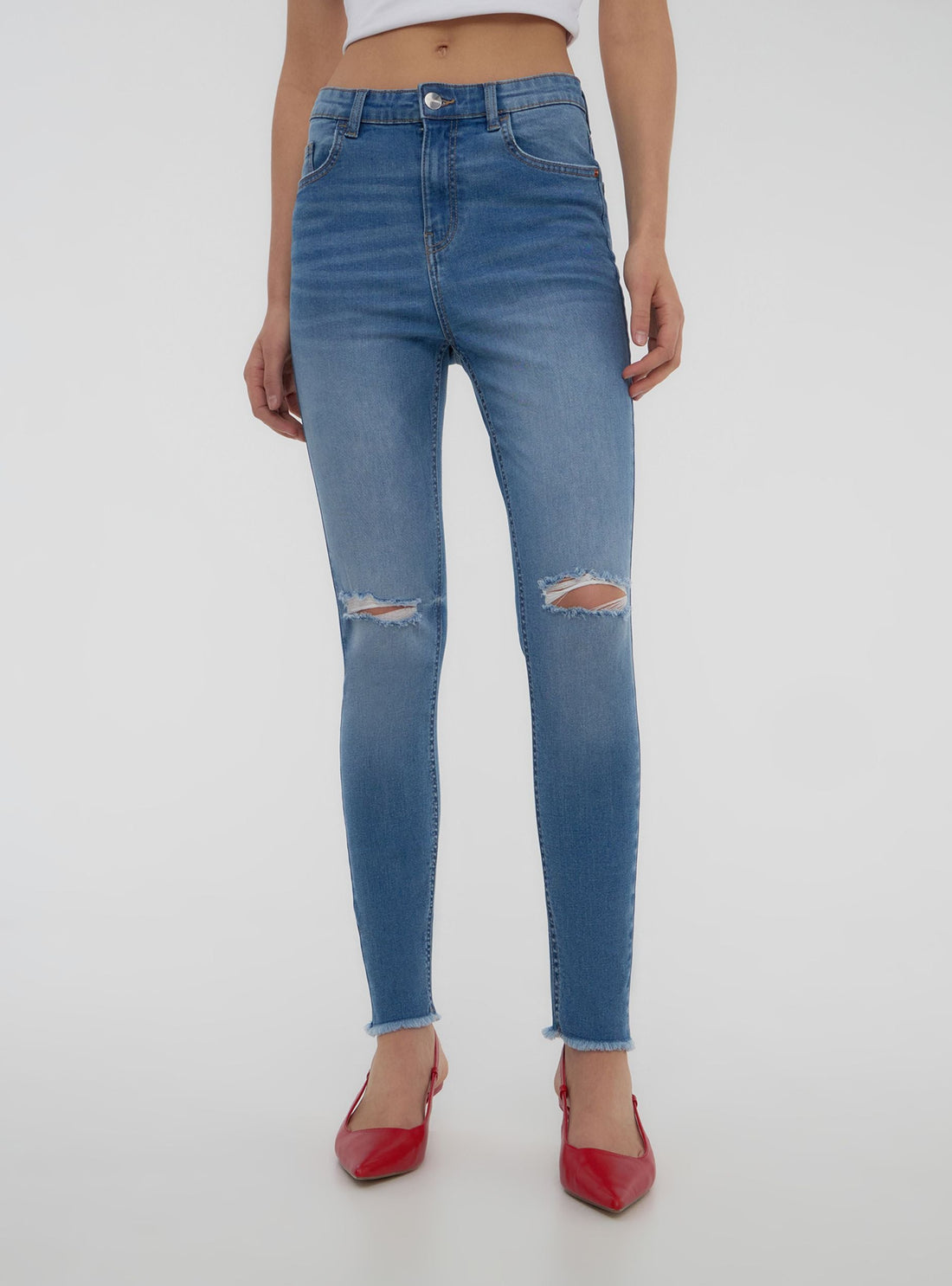 Jeans skinny con strappi