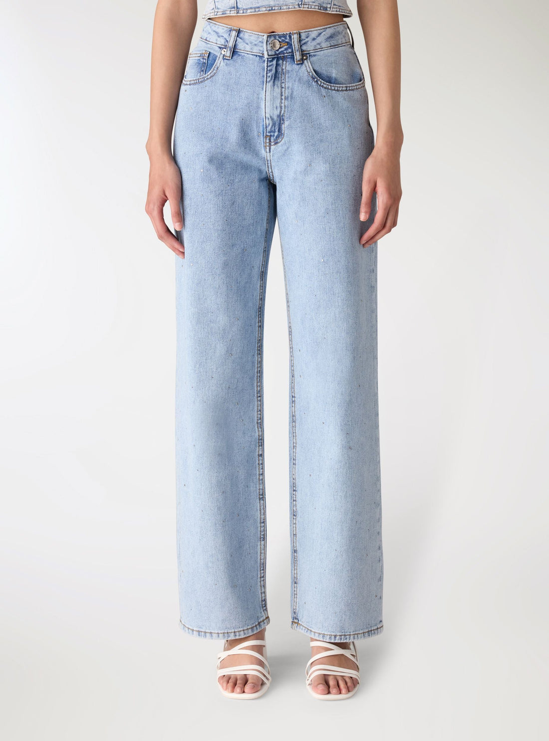 Jeans wide leg con strass allover